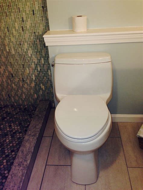 Installed a new high-efficiency toilet with comfort height seat and a ...