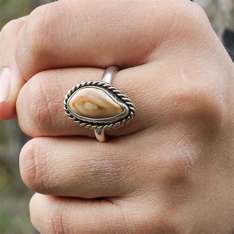 This Elk Ivory Tooth Trophy Antler Ring is featured in Sterling Silver and 14K yellow gold but ...