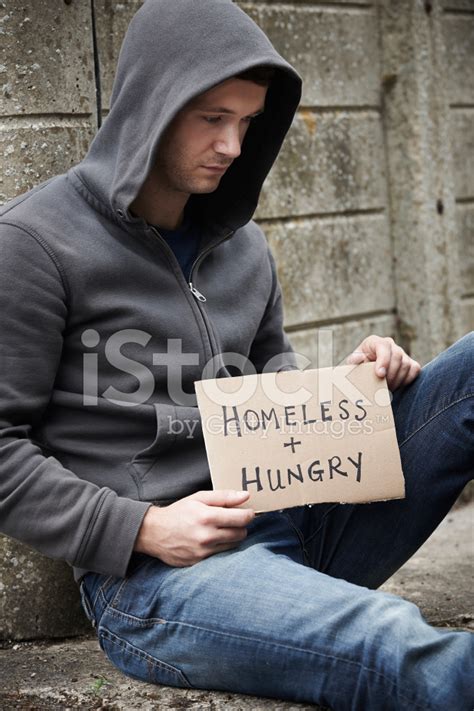 Homeless Young Man Begging On The Street Stock Photo | Royalty-Free ...