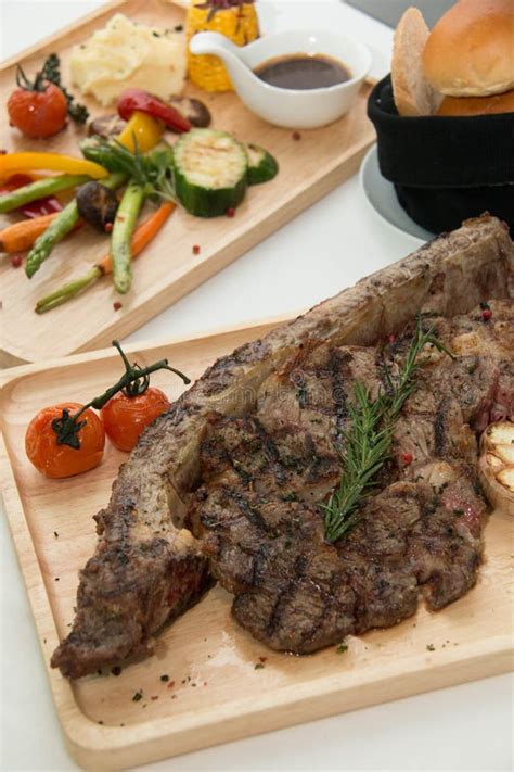 Grilled Tomahawk Beef Steak Cut with Fresh Rosemary and Tomat Stock ...