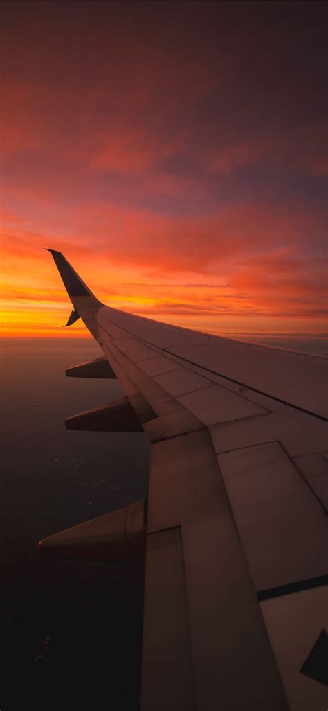 Sunset View From the Window of an Airplane iPhone X Wallpapers Free Download