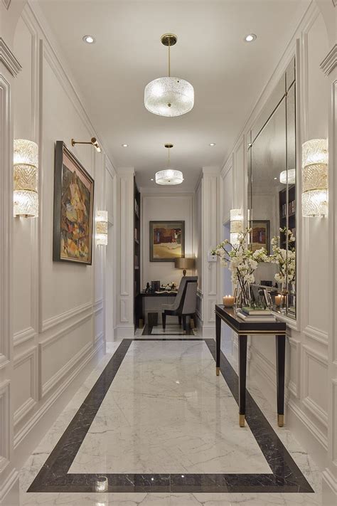 The main entrance hall has extravagant marble flooring and panelled ...