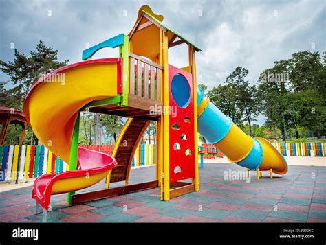 Colorful children playground in the park Stock Photo - Alamy