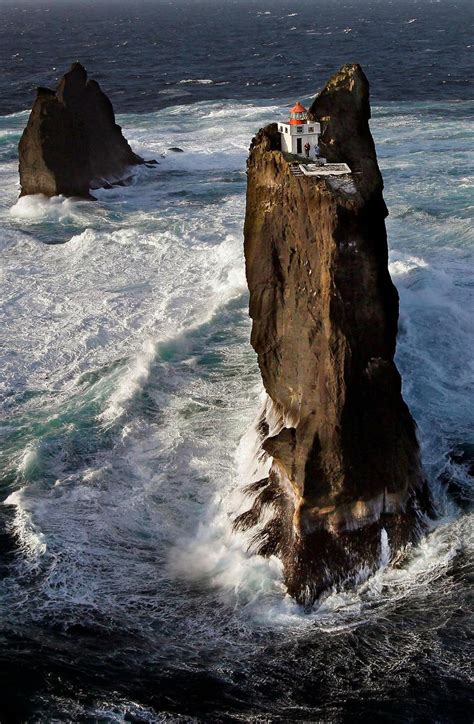 Incredible location for a lighthouse perched on a rock in Iceland's wild surf - Iceland Monitor