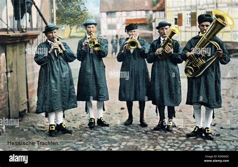 German brass band, Hessian folk music Men in traditional costume standing in square Lauterbach ...