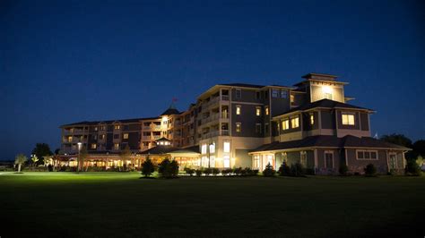 a large building lit up at night with lights on