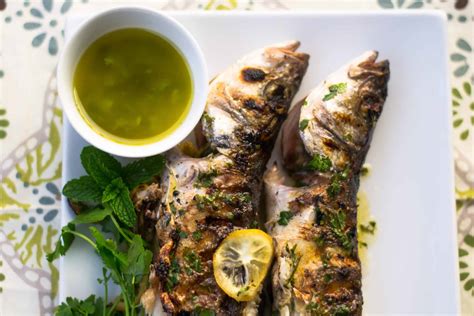 Grilled Branzino with Lemon Slices, Fresh Herbs and Citrus Olive OIl