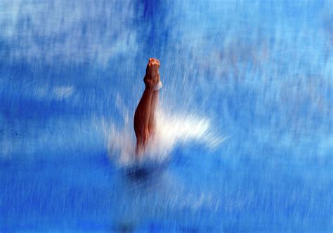 An Athlete Practises Platform Diving Photograph by Carlos Barria