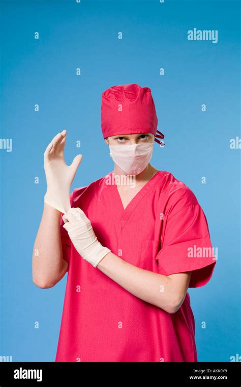 Female doctor wearing scrubs Stock Photo - Alamy