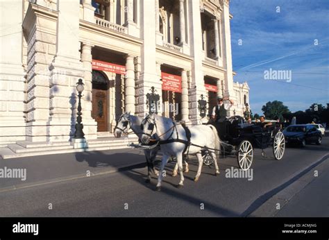 Hackney carriage in front of Burgtheater theatre in Vienna Austria Stock Photo - Alamy