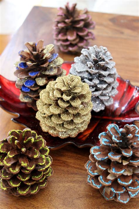 How to Decorate Pinecones With Glitter | Cones crafts, Pine cone decorations, Pine cone crafts