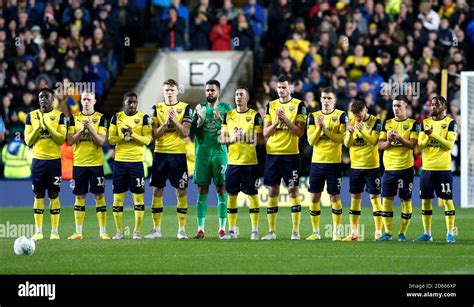 Oxford United players observe a minute's silence in tribute to former ...