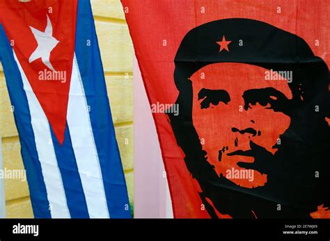 Cuban National Flag with banner of communist icon Che Guevara, Cuba ...