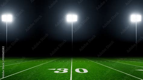 Football field illuminated by stadium lights Stock Photo | Adobe Stock