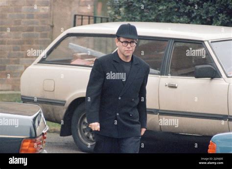 Elton John, at Freddie Mercury's funeral at West London Crematorium. 27th November 1991 Stock ...