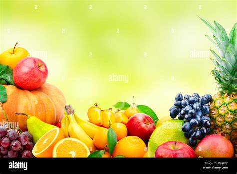 Large collection of fruits and vegetables on blur green background. Copy space Stock Photo - Alamy