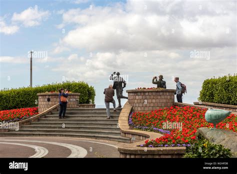 Bronze statue of famous English comedian Eric Morecambe at the seafront ...