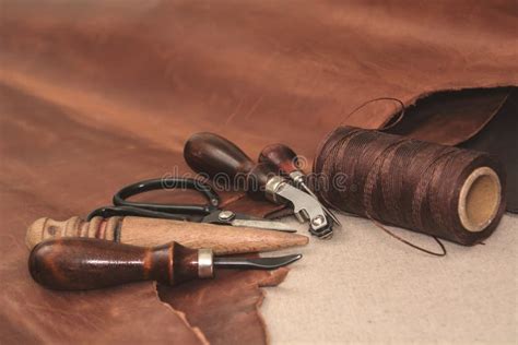 Tools For Leather Crafting And Pieces Of Brown Leather Stock Photo - Image of design, dark ...