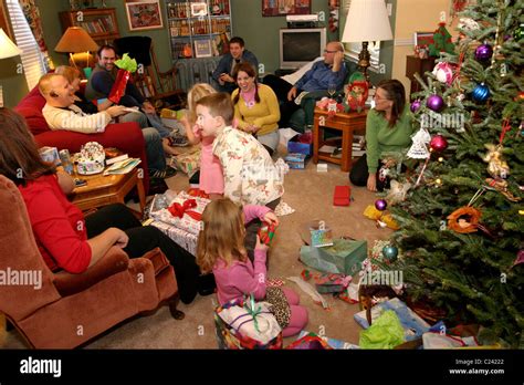 Family opening and giving presents to each other on Christmas day Stock ...