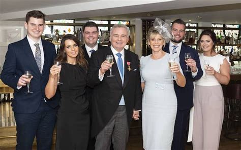 Eamonn Holmes shares rare family photograph with all four children as he celebrates OBE honour ...