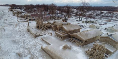 Drone footage shows houses on Lake Erie covered in ice