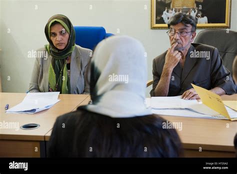 Birmingham Sharia Council at the Birmingham Central Mosque.Council members listen to a woman ...