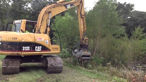 CAT 312C Excavator with FAE Mulcher Attachment - YouTube