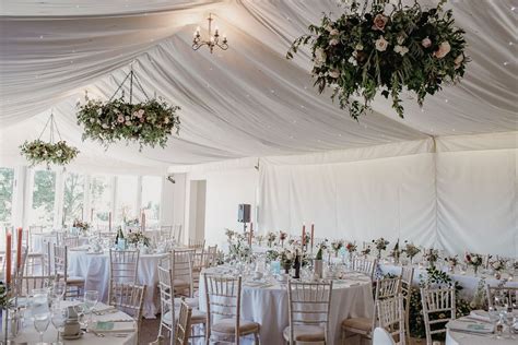 Marquee Wedding Reception with Floral Chandeliers, Floral Centrepieces ...