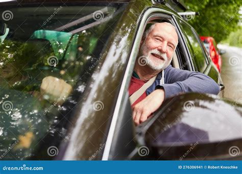 Senior Man Looking through Window while Driving Car Stock Image - Image ...