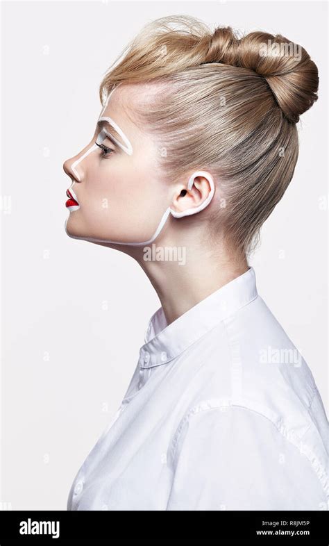 Side view of beautiful young woman on gray background. Female with an ...