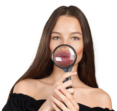 Premium Photo | Girl looking through a magnifying glass