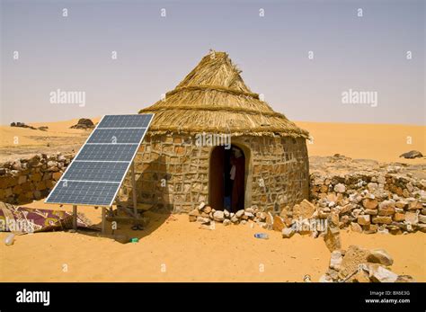 Traditional house with a solar panel in the Sahara Desert, Algeria ...