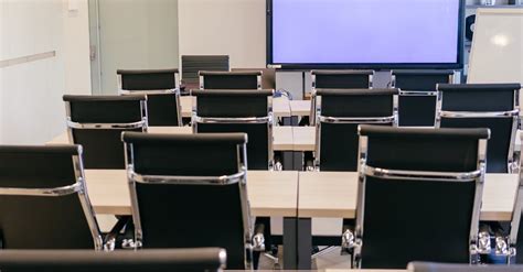 Black Office Chairs at Wooden Table in Conference Room · Free Stock Photo