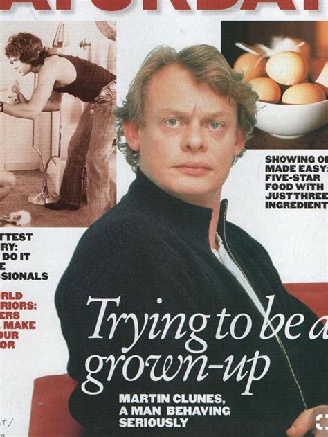 a magazine cover with an image of a man in black sweater and white shirt on it