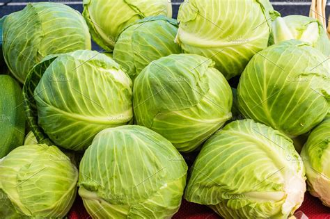 Green cabbage in a display | High-Quality Food Images ~ Creative Market