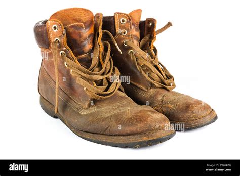 Pair of old worn brown leather work boots on white Stock Photo - Alamy