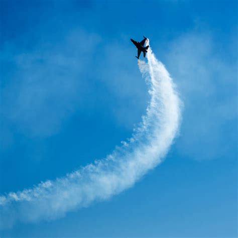 Airplane Vapor Trail Stock Photos, Pictures & Royalty-Free Images - iStock