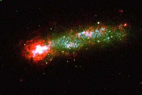 Tadpole galaxy spawns stars after eating invisible gas cloud | New ...