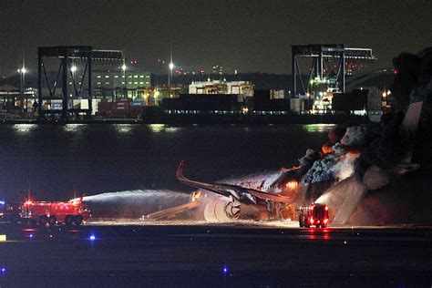 JAL passengers escape blaze after collision at Tokyo airport | Inquirer ...