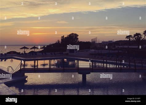 Sunset reflections in the pool Stock Photo - Alamy