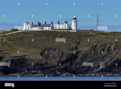 Lizard Point Lighthouse on a bright day, photo from the sea Stock Photo ...