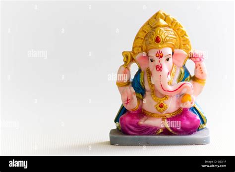 Lord Ganesh, Hindu God figure in white background Stock Photo - Alamy