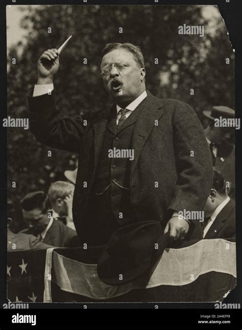 Theodore Roosevelt speaking from flag draped platform Stock Photo - Alamy