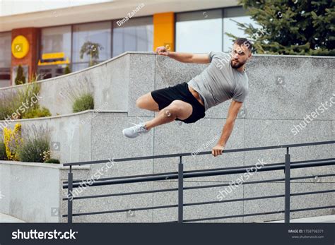 Man Jumping Over Fence: Over 358 Royalty-Free Licensable Stock Photos ...