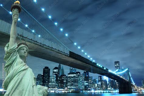 Brooklyn Bridge and The Statue of Liberty at Night Stock Photo | Adobe ...