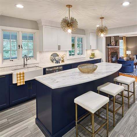 Navy and blue kitchen with brass accents and marble countertops by Case Design/Remode… | White ...