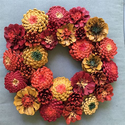 Fall Zinnia Pinecone Wreath | Pine cone crafts, Pine cone art, Wreath ...