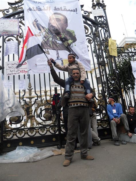 Boy grabs the Egyptian flag from his father as he demonstr… | Flickr