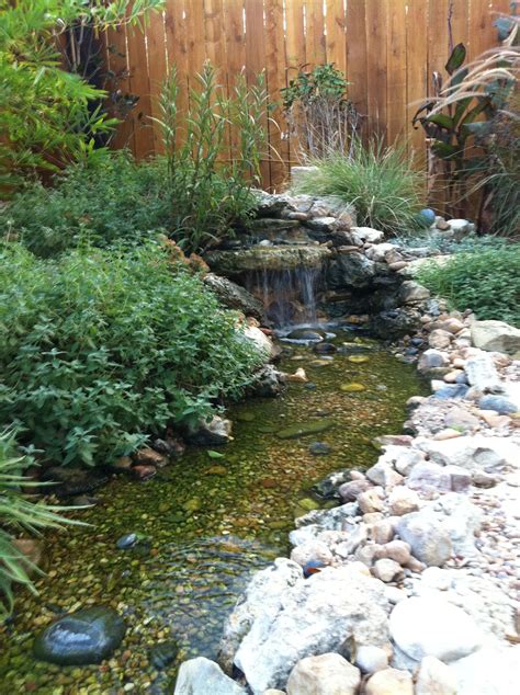 small waterfall that empties into a disappearing stream | Water features in the garden, Water ...