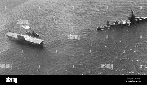 USS Northampton (CA-26) standing by the damaged USS Hornet (CV-8) during the Battle of the Santa ...